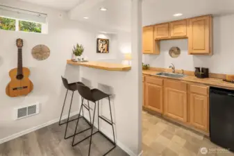 A great space in the basement for entertaining and hanging out! Mini fridge shown here.