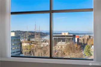 The living room provides grand views of the Olympic Mountains & Puget Sound.