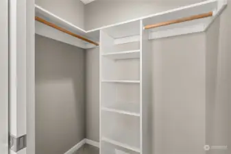 Primary bedroom has a walk-in closet with built-in shelving.