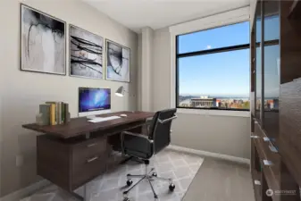 Second bedroom is virtually staged as an office and also looks out on the captivating view.