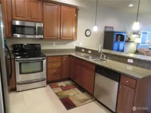 All appliances are stainless.  Ceramic flooring, granite counters.