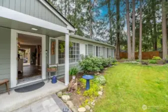 Come on in.  Hand laid stone provide a stunning walk-way.