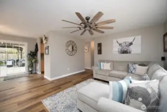 As you enter the sun soaked living room you can see right out to the gorgeous backyard. New flooring warms the home throughout.  Also enjoy clean walls and fresh paint.