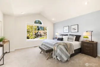 Primary Bedroom with vaulted ceilings.