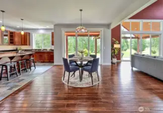 Dining area and kitchen open up to the spacious covered porch.