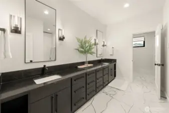 Extended double vanity with separate walk-in closet & commode.