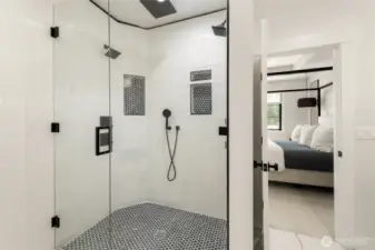 Primary Suite shower has multiple shower heads w/featured waterfall.