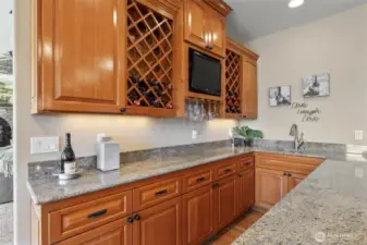 Enjoy fun times entertaining with this wine serving area and wet bar!