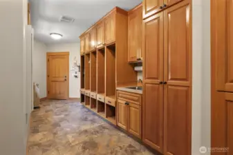 This is the mudroom/laundry room that has a space for everything!! Utility sink, washer/dryer and you can enter right from the 3 car garage!