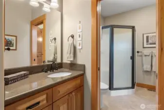 This shows how the separate vanity areas that enters into the shared 3/4 bathroom (shower area).