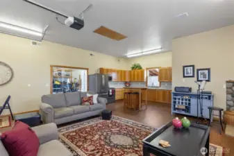 Shop has pull up door to the Studio! Studio has kitchen area, 3/4 bathroom, electric heat and freestanding wood stove. Notice the pull down storage attic stairs!