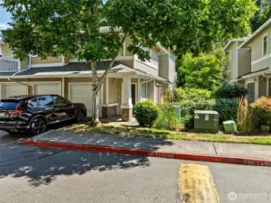 One car garage PLUS off street parking for 1 car.  (Subject garage is the middle one)