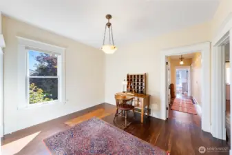 From the entryway Foyer, this Office space has a large closet on the left.  The main level hallway leads to the bathroom on the left with the bedroom at the end of the hall.  The doorway on the right leads to the living room.