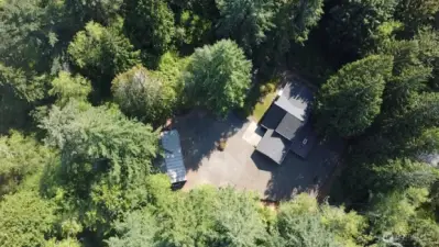 Aerial showing home and shop.
