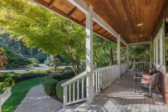 A lovely covered wrap-around porch provides endless hours of enjoyment for reading, visiting, morning coffee, serving as a respite on sunny or rainy days.