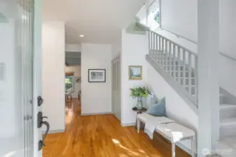 A welcoming entrance provides a puncutation between the upstairs on the right, living room on the left and the the family/great-room and kitchen to the back.