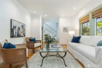 Large windows present a wonderful layered view of gardens, trees and sunlight!