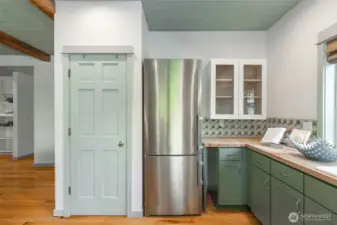 Addtional storage/pantry for this sweet kitchen with all the warmth of a friendly space for cooking.