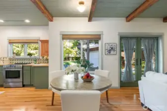 Imagine dining in the kitchen w/french doors opening to the garden and a cozy fire in the sweet family room to the right. What a great way to spend a morning breakfast or a lovely lunch with friends or family.
