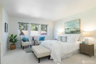 Lovely primary bedroom, plenty of room with new carpet located at the back of the home affords a quiet, peaceful space.