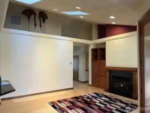 Come in from the entry to the vaulted ceiling living room. Master Bedroom to the back right.  Propane fireplace.  The wicker egrets on the shelf are optional.