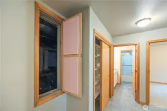 Access to the high clearance crawl space, but you don't have to crawl.  It's that tall.  Plenty of room for more storage here as well as under the stairs.