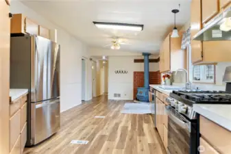 View back towards french doors to deck & wood stove