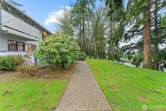 Peaceful, park-like grounds surround the community with mature evergreens, open green space, and well-maintained walking paths. A serene setting that offers a true sense of privacy.