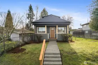 Front facade, semi-enclosed front porch with warm PNW exterior paint colors.