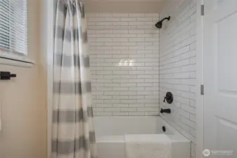 New shower surround, fixtures and bathtub