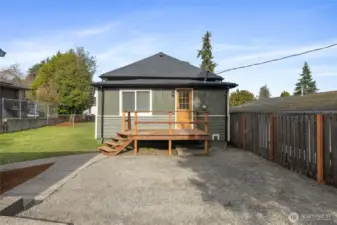 New back deck with pressure treated lumber. RV or additional parking