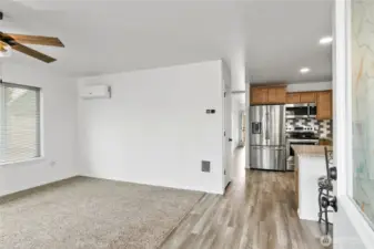 Living room with   mini-spilt and ceiling fan.