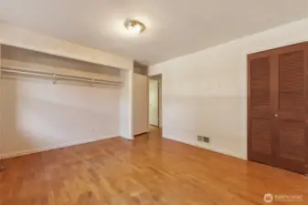 Second bedroom also hosts wood floors and dueling closets!