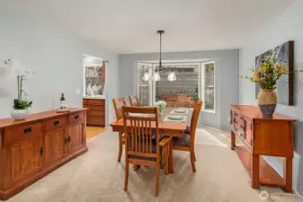 Formal dining room overlooking beautifully landscaped backyard