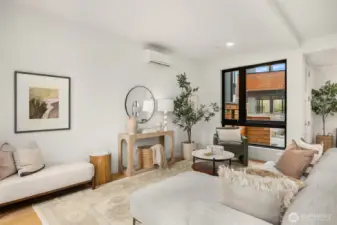 The spacious living room provides a comfortable and versatile area for relaxation, entertainment, and gatherings.