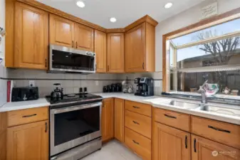 Welcome to this beautifully maintained West Campus home! Sunny eat in kitchen with induction stove.