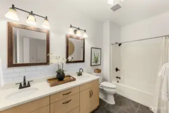 Updated primary bathroom with double sinks for added convenience.