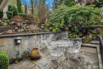 The patio wraps around for a second seating/dining area outside the family room.