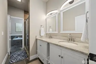 The primary bath has a dual sink vanity and a lot of storage space. The oversized shower has two heads and the large soaking tub has jets.