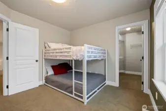 This bedroom also has a walk-in closet and it looks onto the side yard.