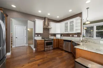 The kitchen has abundant cabinet and counter space and very well-appointed. There is a gas range with a pot-filler above it.