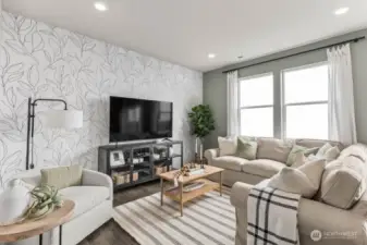 Enjoy reading or movies in the great room. Pictures are representative of Burnham floorplan. Colors and options will vary. Photos from Model Home on 30. Homesite 77 is a mirror image.