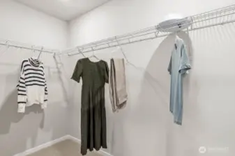 Primary walk-in closet. Pictures are representative of Burnham floorplan. Colors and options will vary. Photos from Model Home on 30. Homesite 77 is a mirror image.