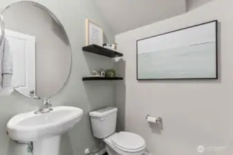 Cute powder room just beyond the foyer. Pictures are representative of Burnham floorplan. Colors and options will vary. Photos from Model Home on 30. Homesite 77 is a mirror image.