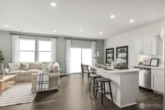 Gather in this comfortable open-concept main floor. Pictures are representative of Burnham floorplan. Colors and options will vary. Photos from Model Home on 30. Homesite 77 is a mirror image.