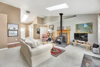 Enter into a bright living room with skylights.