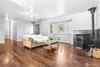 Unwind and enjoy the crackling sounds of a pellet stove in this cozy, open-concept space.