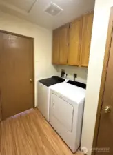 Laundry area with door to dampen operational noise