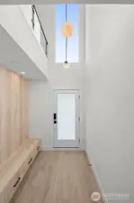 Step into the vaulted mudroom with built-in storage.