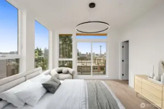 Above, the primary suite offers sweeping views of the city & Lake Union! Imagine waking up to this every day! This image is virtually staged.